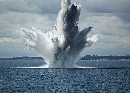 Image showing a huge water fountain caused by a below surface explosion