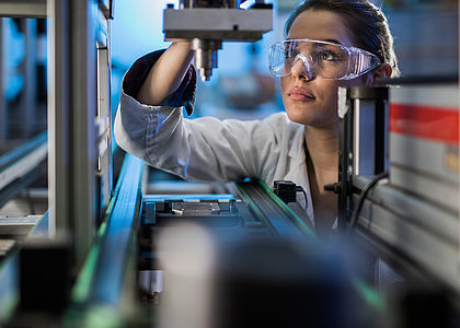 Image showing an Engineer examining machine part on a production line during performance testing