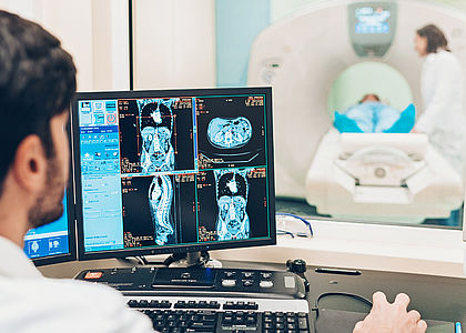 Image showing a doctor looking at a patient's MRI scan results