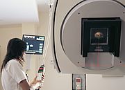 Image showing a Clinician operating a linear accelerator