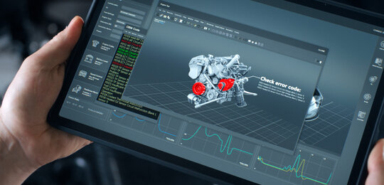 Close up of two hands holding a diagnostic pad showing a 3D schematic of a car engine. Two sections of the engine are in red indicating problematic areas