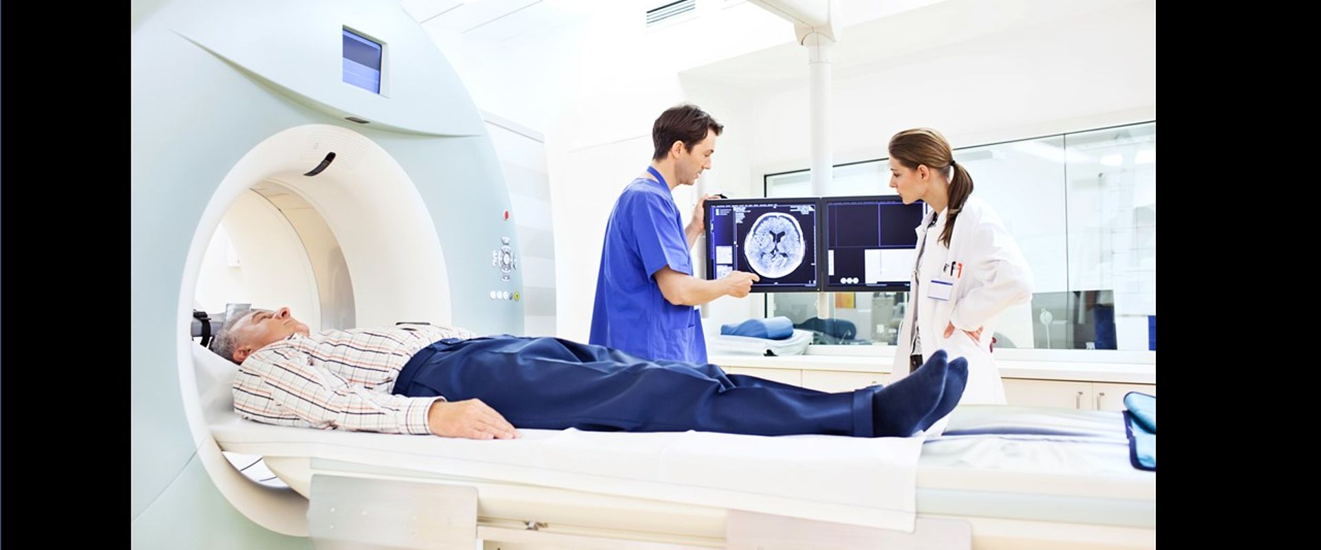 Image showing Two doctors discussing a CAT scan