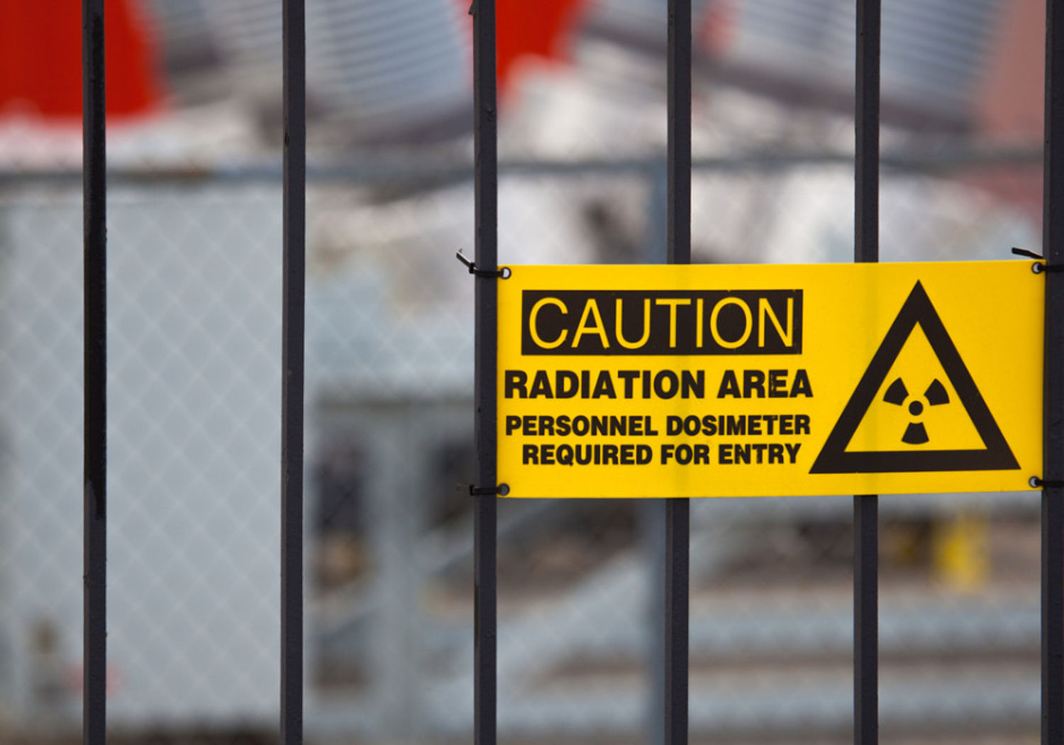 Image showing a radiation warning sign on a gate