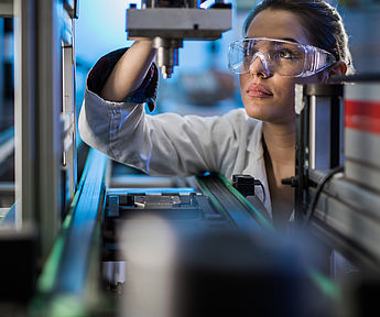 Image showing an Engineer examining machine part on a production line during performance testing