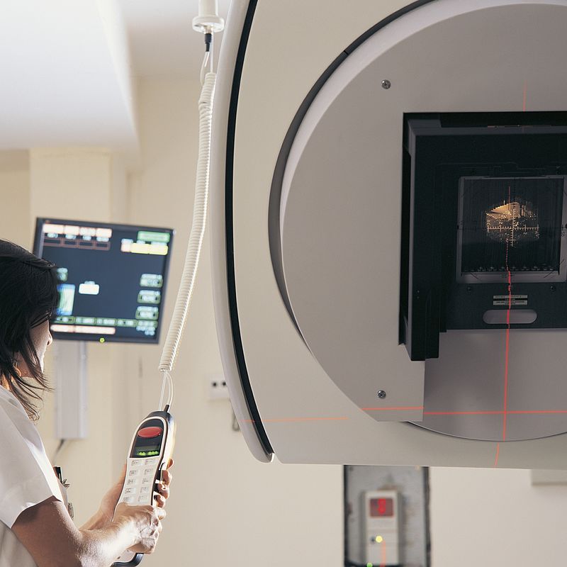 Image showing a Clinician operating a linear accelerator