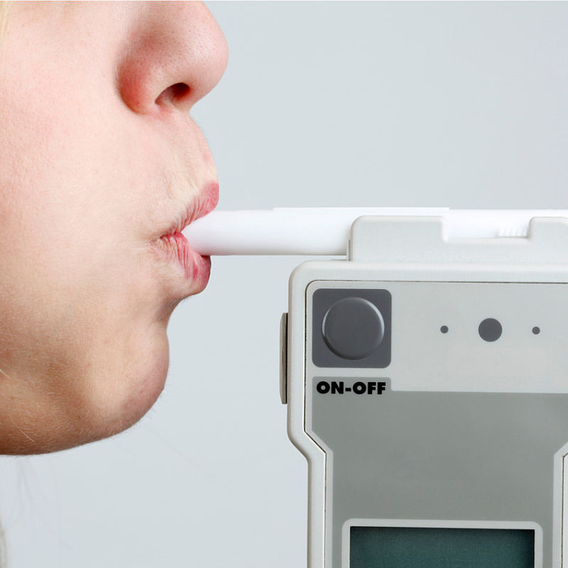 Image showing a person blowing in breathalyser