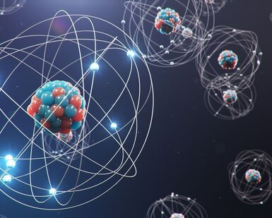 Against a dark background are an artist’s illustration of atomic structures with an atom with a large number of neutrons and protons in the foreground with other atoms in the distance