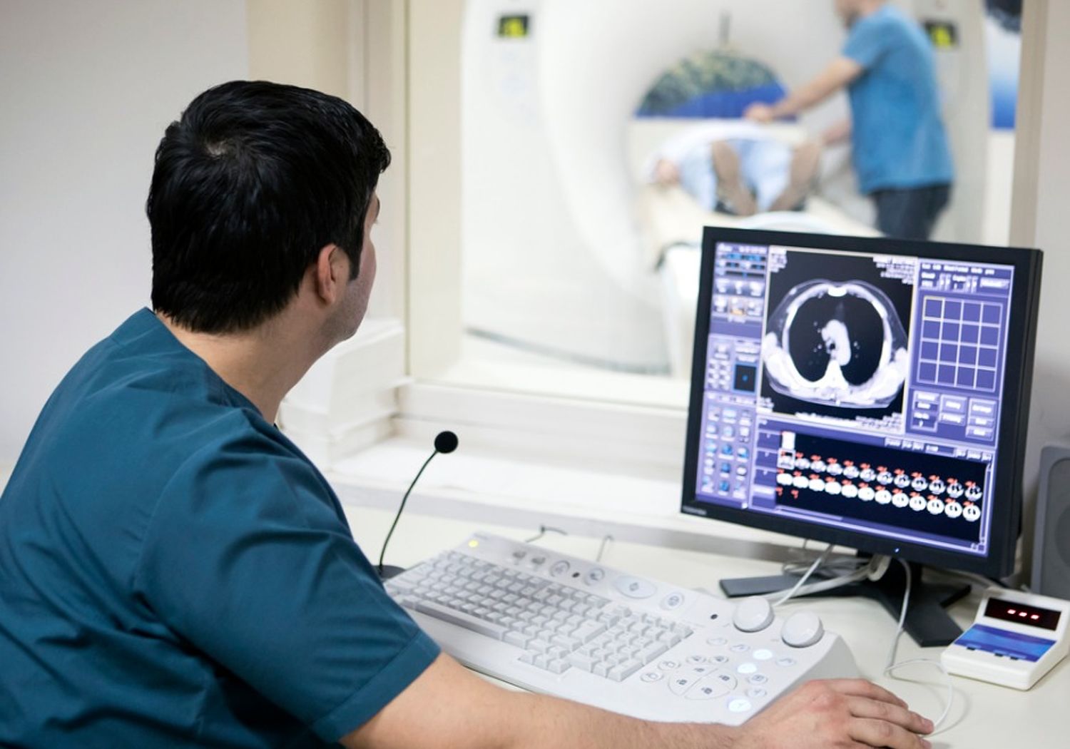 Image showing radiologist examining a patient's scan results