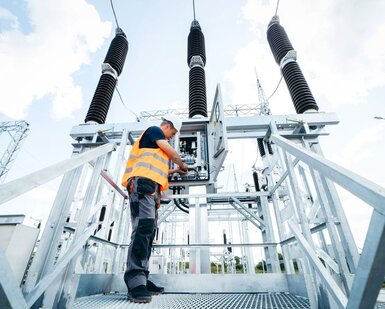 Engineer inspecting equipment in an electric substation