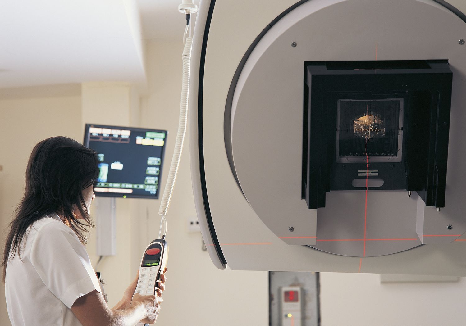 Image showing a Clinician operating a linear accelerator