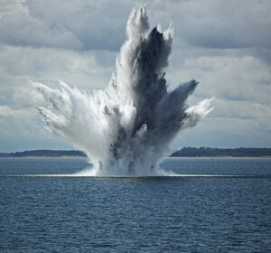 Image showing a huge water fountain caused by a below surface explosion