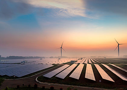 Sunrise at a solar power plant Image showing sunrise at a solar power plant