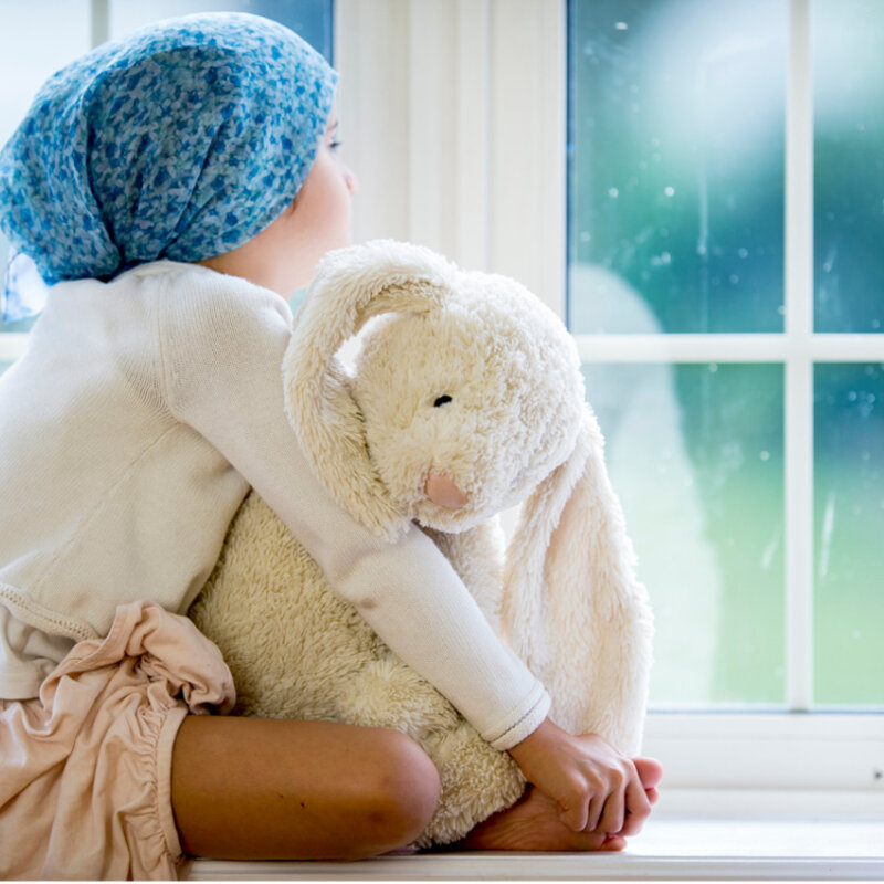Metrology for advanced radiotherapy Image of a small child with toy sitting at a windowsill