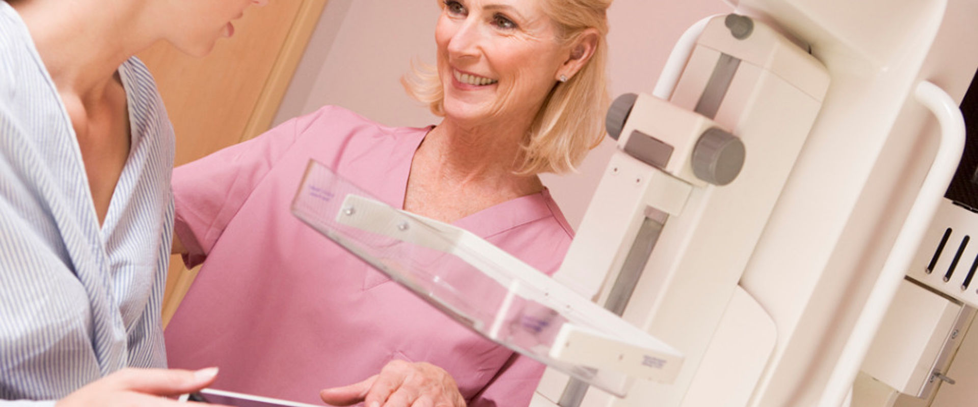 Nurse with patient having a mammogram picture id92216734